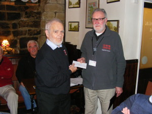 Barrie Blayney presents Mike Lloyd of the YAA with a £100 donation from the branch